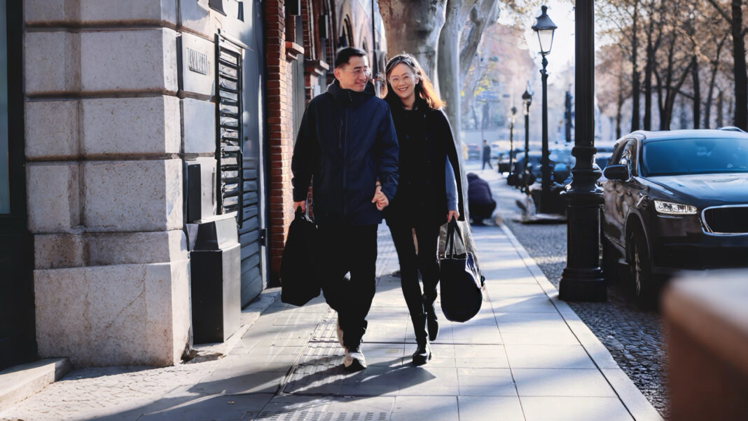 Dr. Qiang Zhang walking home with his wife after work