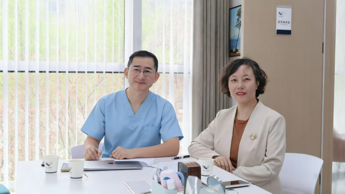 Dr. Qiang Zhang with Ms. Zhou Ning, Senior Editor at People's Medical Publishing House